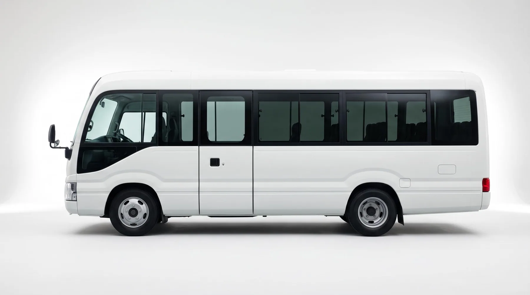 White 30-seater staff bus from the Decent Way fleet