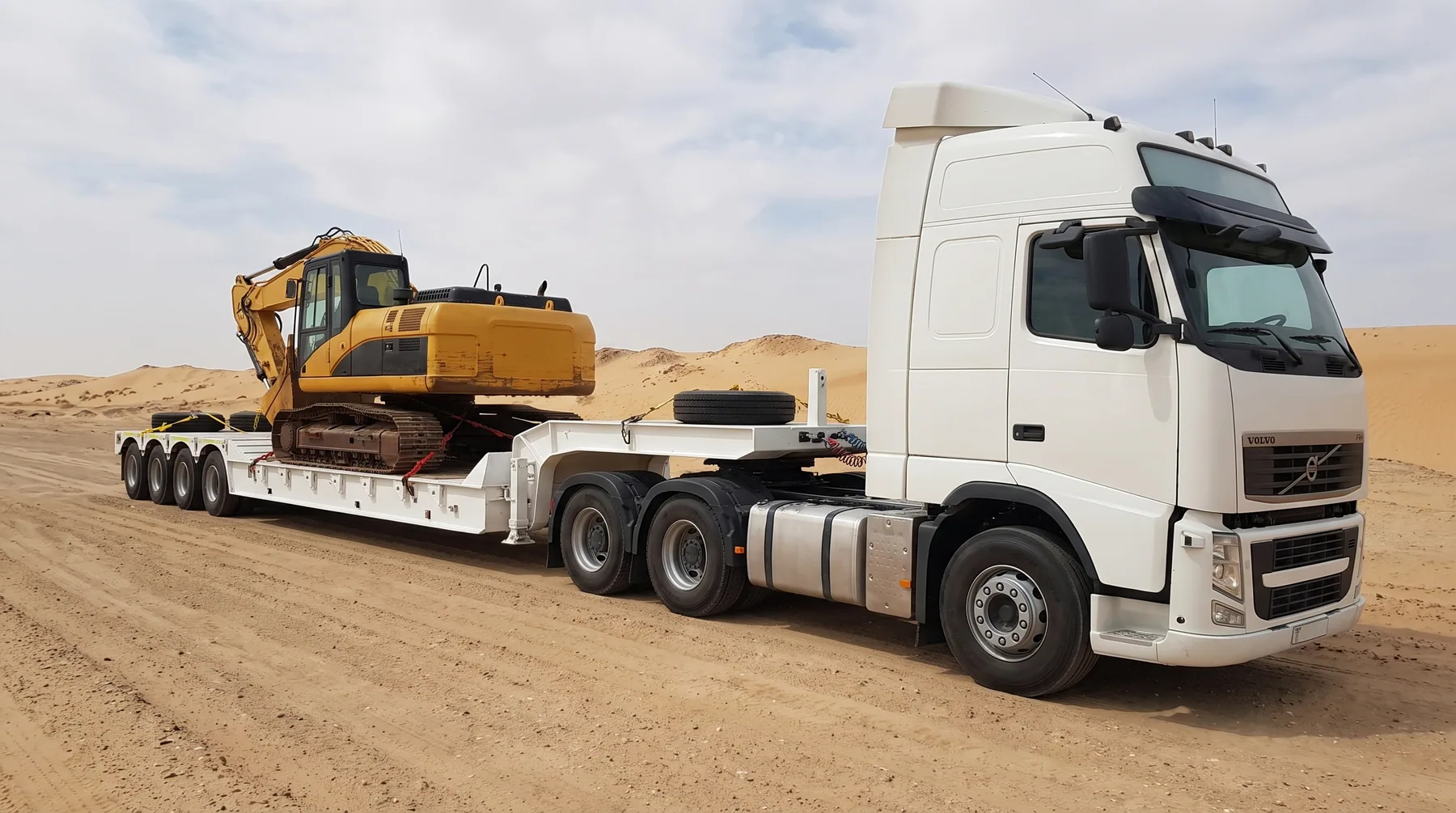 White multi-axle lowbed trailer for heavy machinery